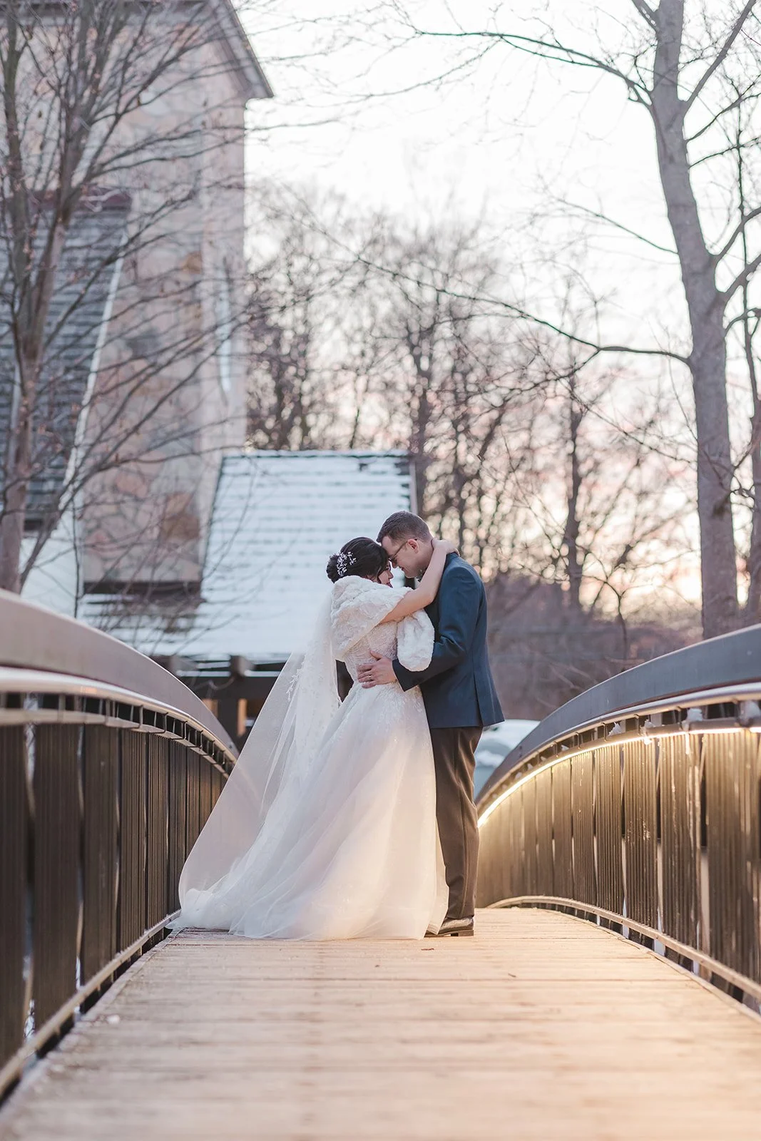 Bride and groom forehead to forehead on bridge  Ancaster,  ON  Ancaster Mill  Fedora Media.jpg