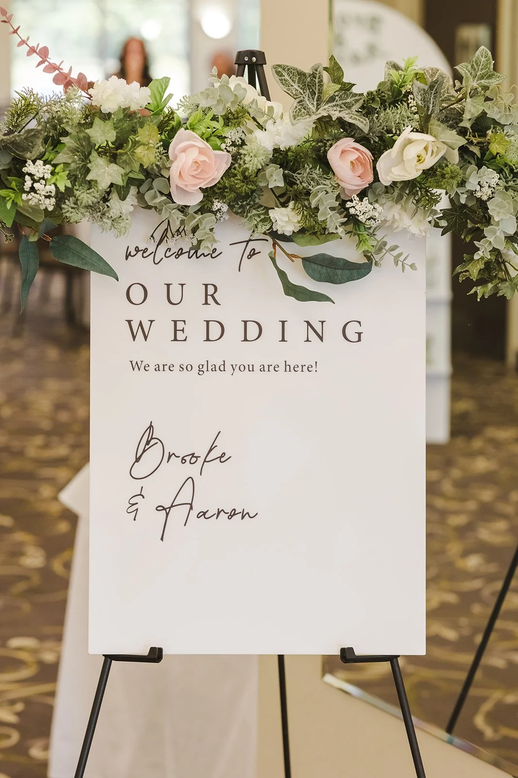 Wedding welcome sign with flowers Century Pines  Fedora Media.jpg