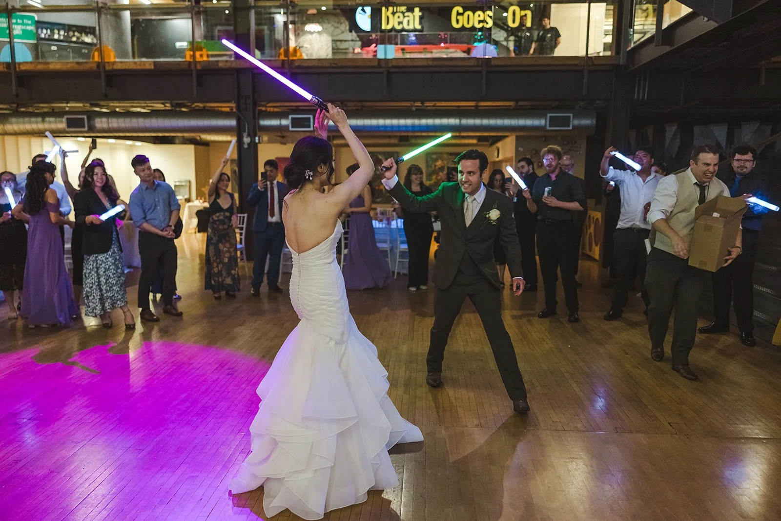 Bride and Groom having lightsaber battle  Kitchener, ON  THE museum  Fedora Media.jpg