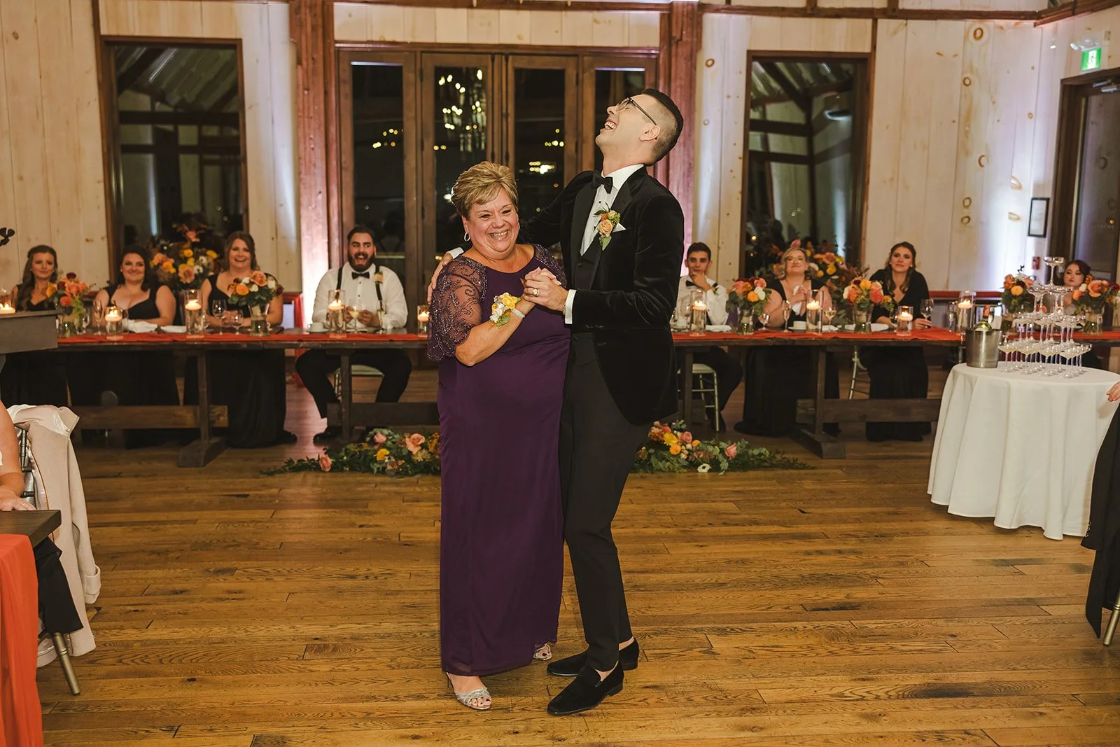 Groom laughs during first dance with mom  Earth to Table  Hamilton, ON  Fedora Media.jpg