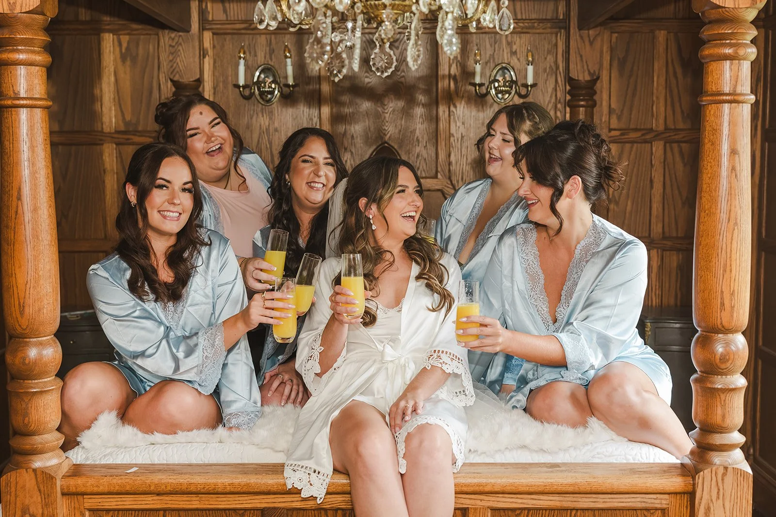 Bride and bridesmaids in bridal suite having mimosas  Erin Estates  Fedora Media.jpg