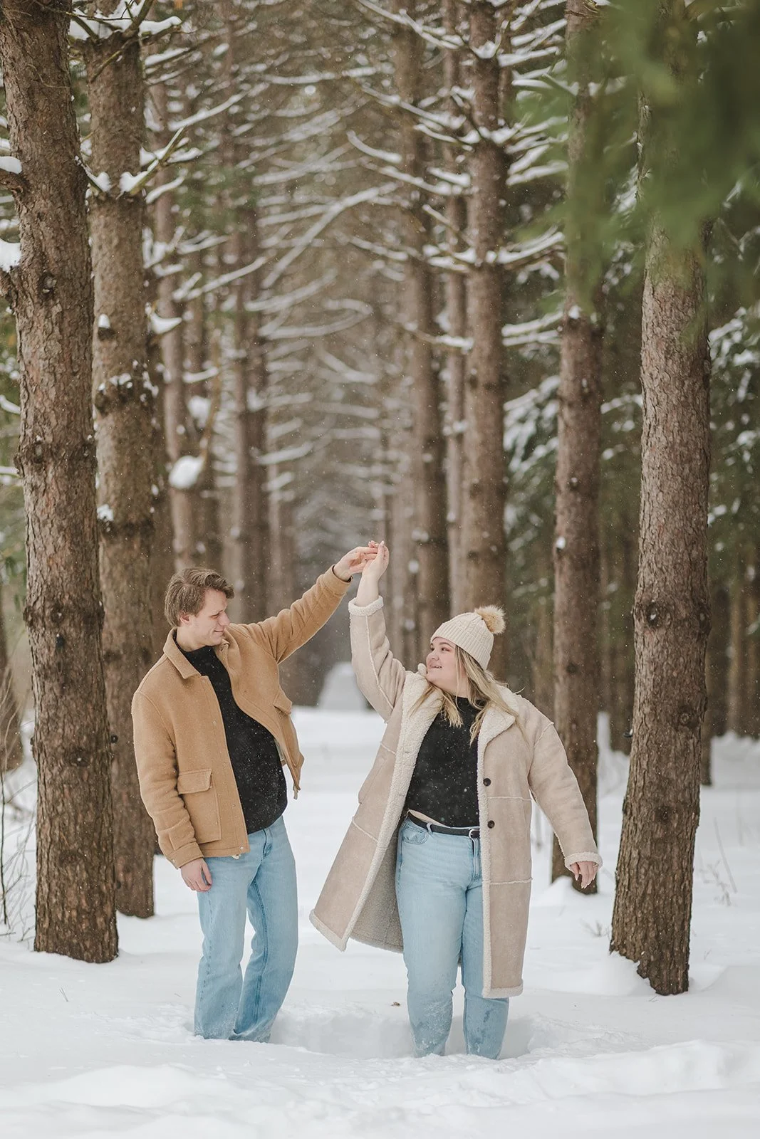 Couple dancing in snowy forest  Ontario Engagement  Fedora Media.jpg