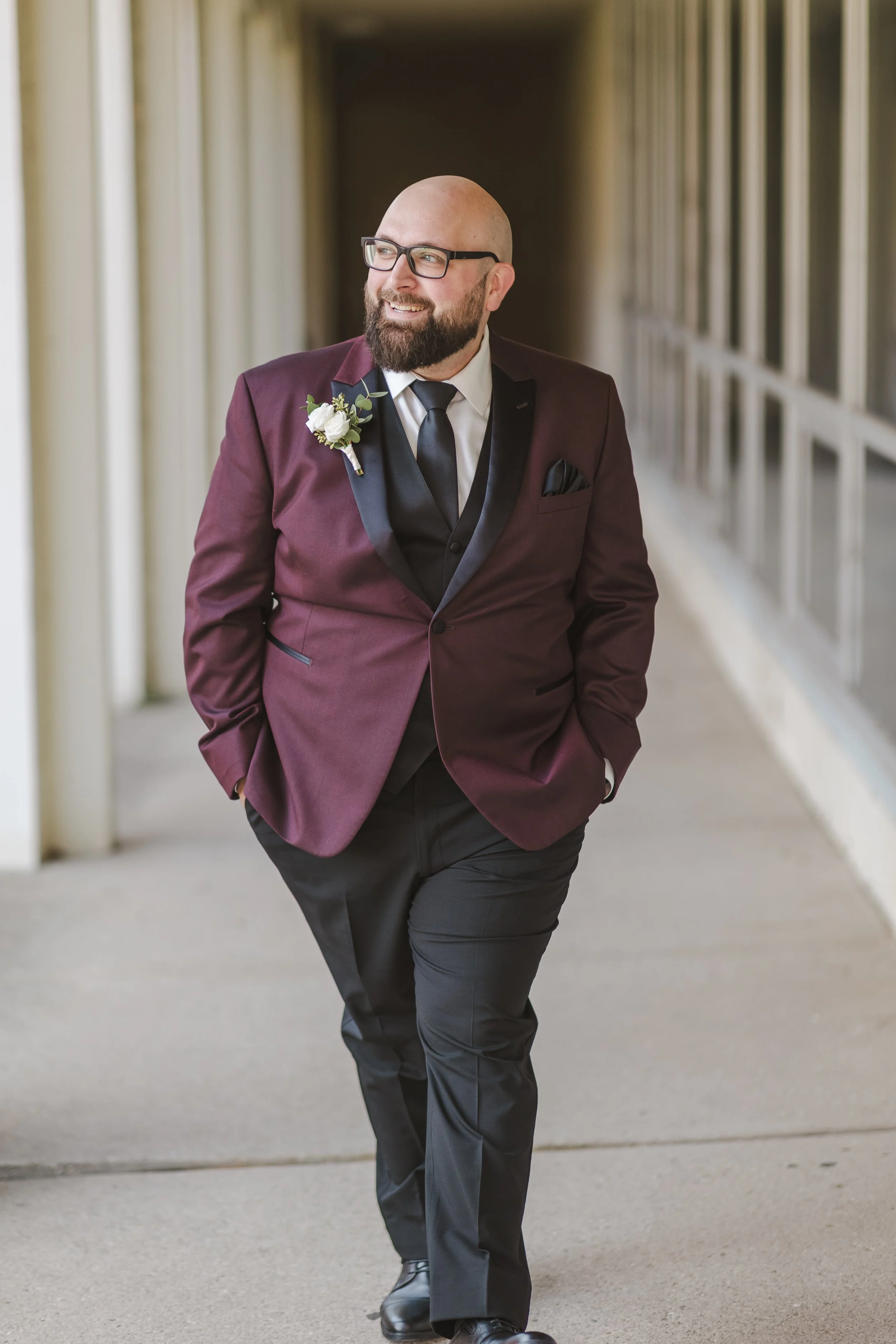 groom-walking-and-smiling-fedora-media.jpg