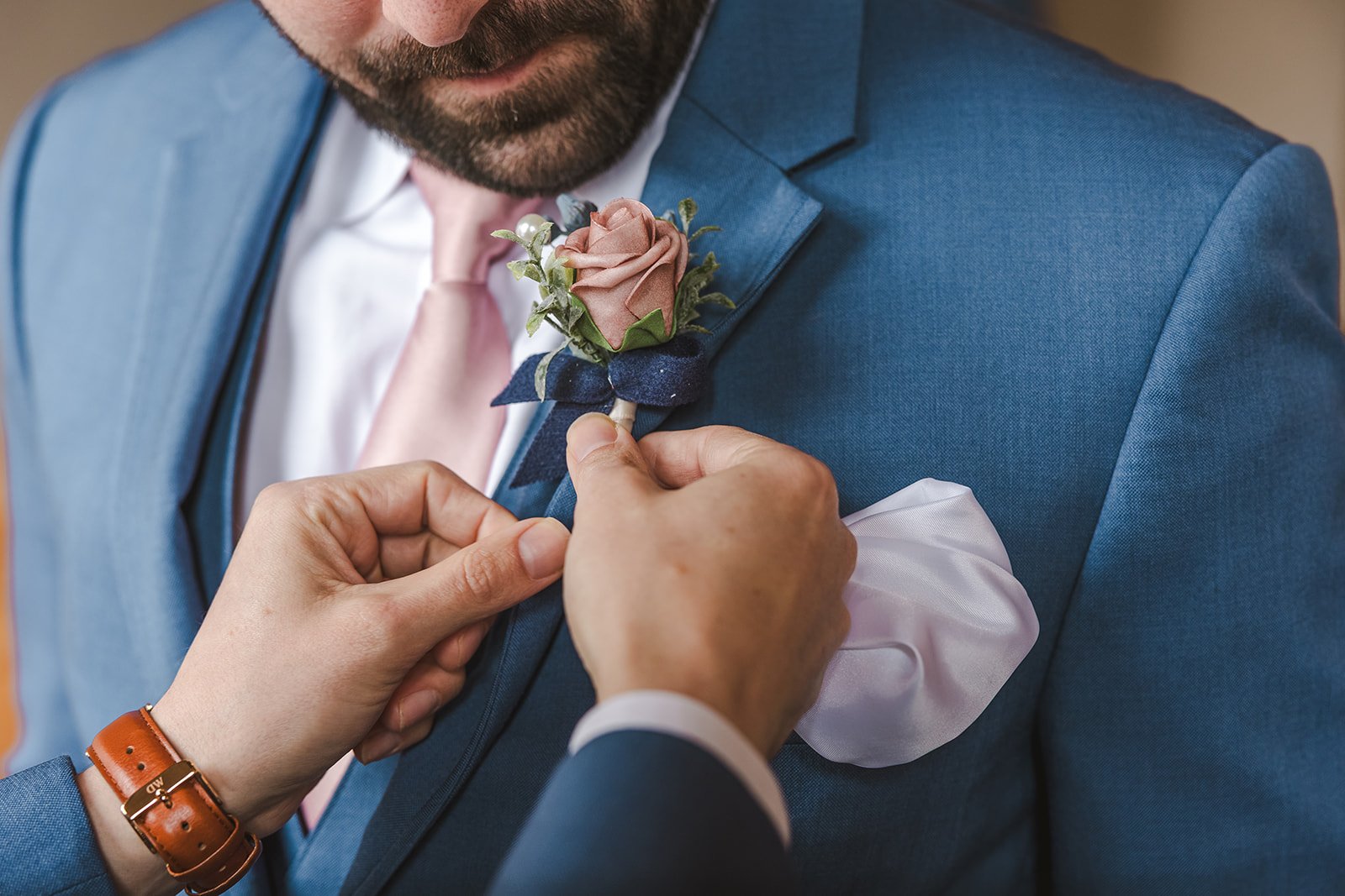 Adjusting Groom's Boutonnaire  Four Fathers  Cambridge, ON  Fedora Media.jpg