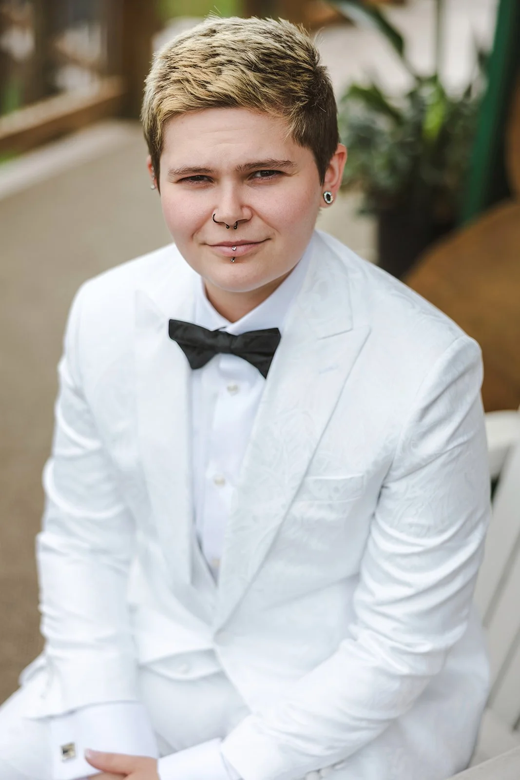 Bride in white suit with black bowtie  Pine Valley Chalet  Kitchener, ON  Fedora Media.jpg