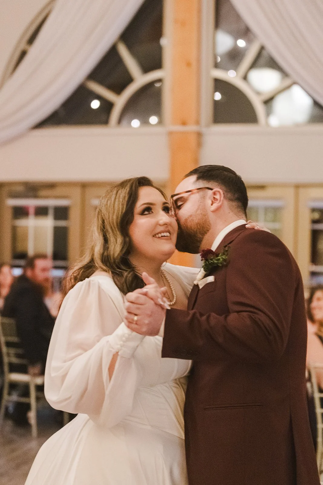 Groom kissing bride on dance floor  Lakeview By Carmens  Hamilton, ON  Fedora Media.jpg
