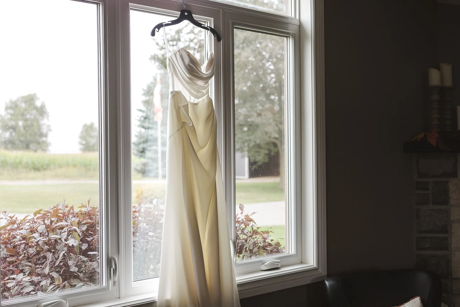 Wedding dress hanging in window  Straford, ON  Fedora Media.jpg