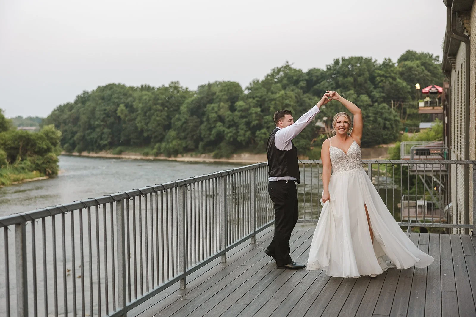 Bride and groom dancing on balcony  Arlington Hotel  River's Edge  Paris, ON  Fedora media.jpg