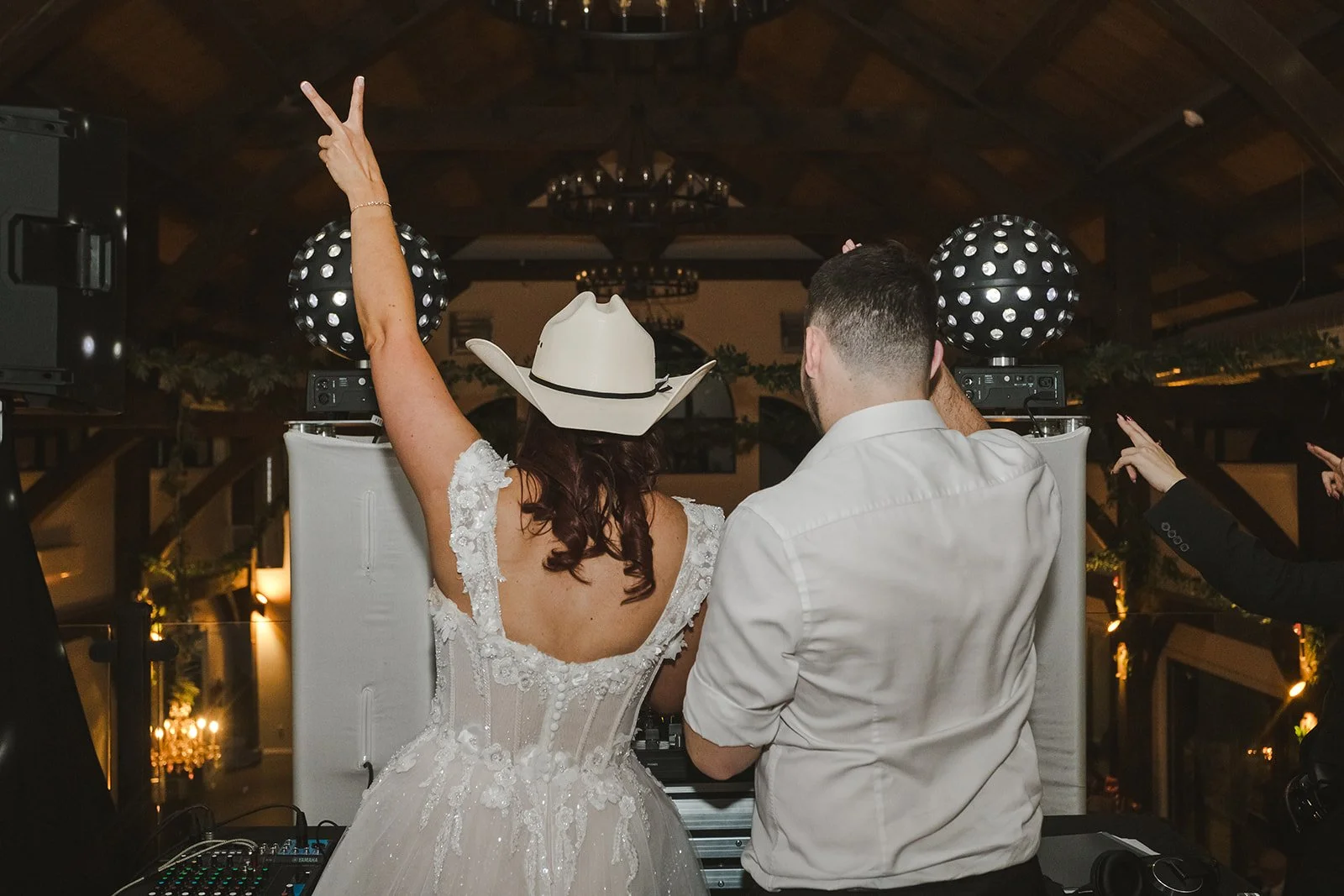 Bride and DJ flashing a peace sign  Erin Estates  Fedora Media.jpg