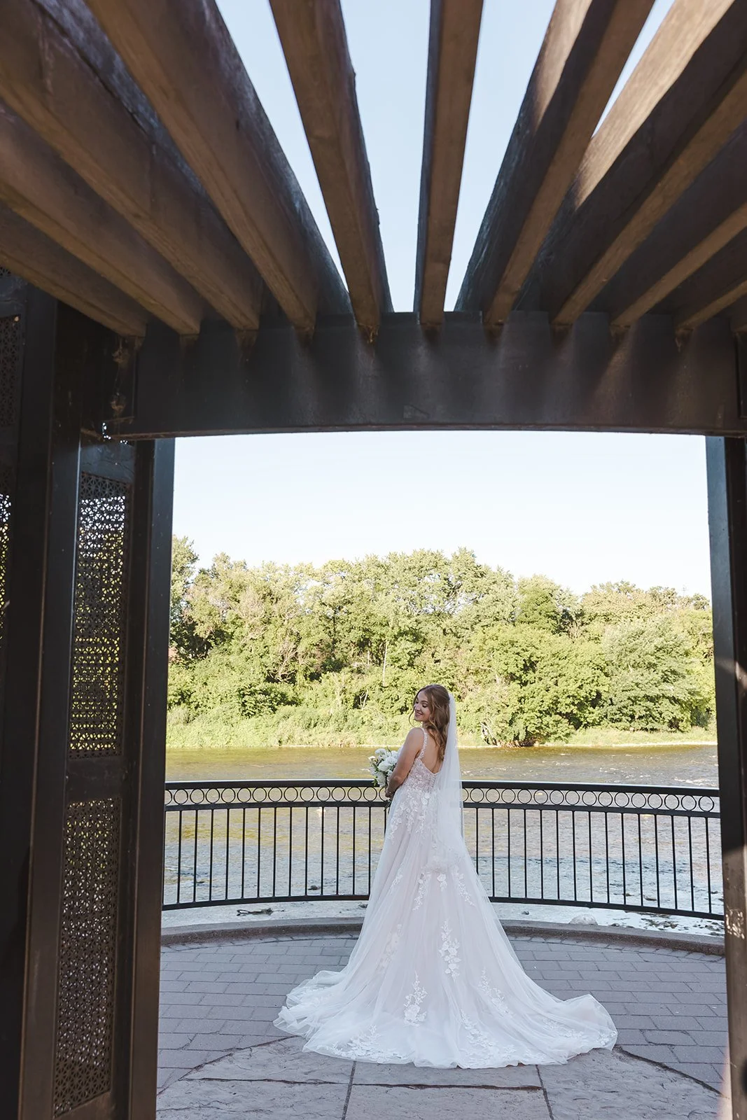 Bride in wedding dress from behind  Paris, ON  Arlington Hotel  River's Edge  Fedora Media.jpg