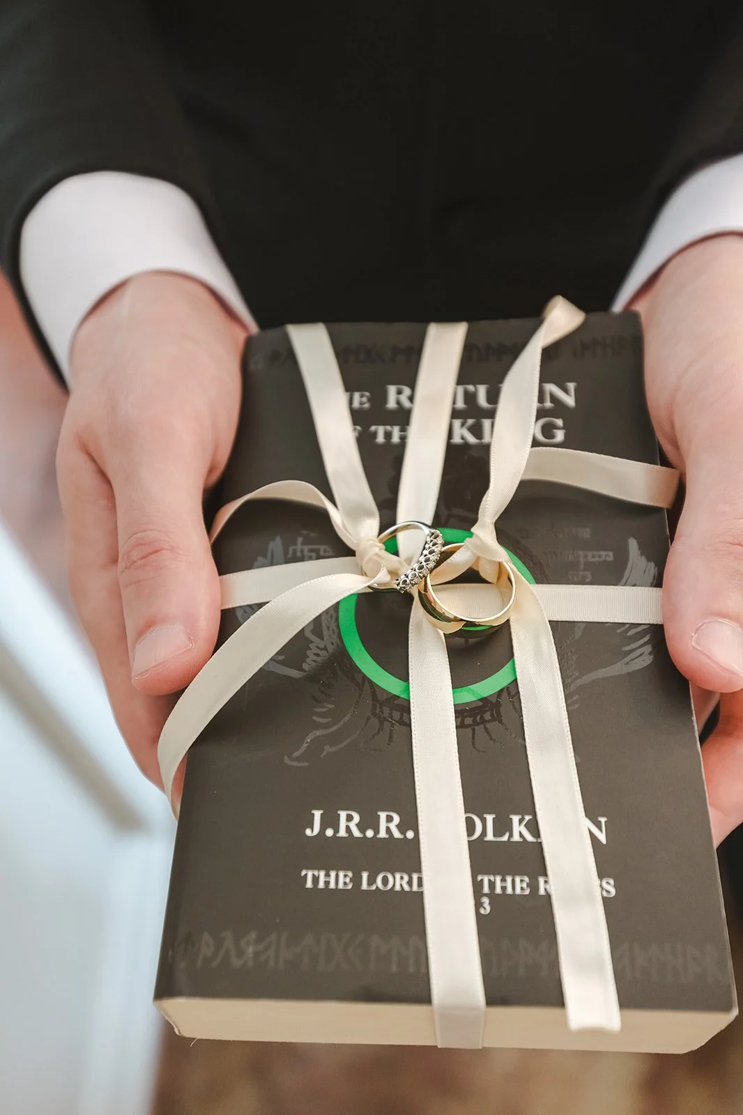 Wedding rings tied to book  Hamilton, ON  Glen Drummond Farm  Fedora Media.jpg