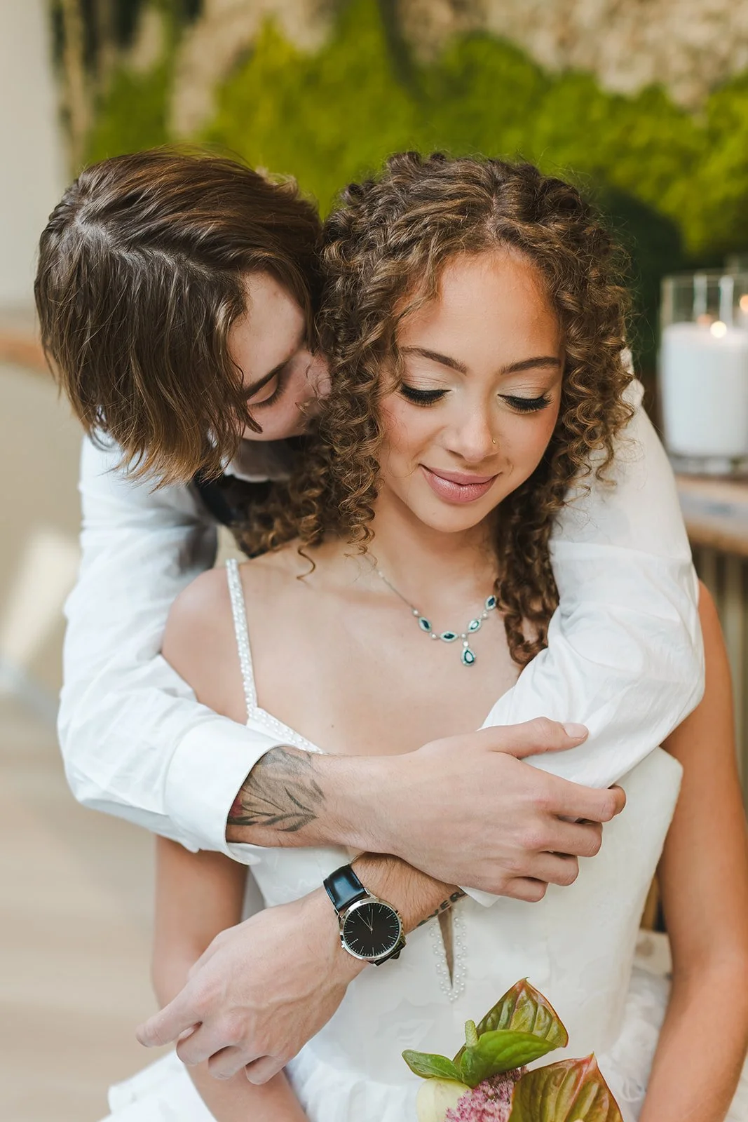 Groom hugs bride from behind while kissing her cheek  Urban Jungle  Black Shop Restaurant  Cambridge, ON  Fedora Media.jpg