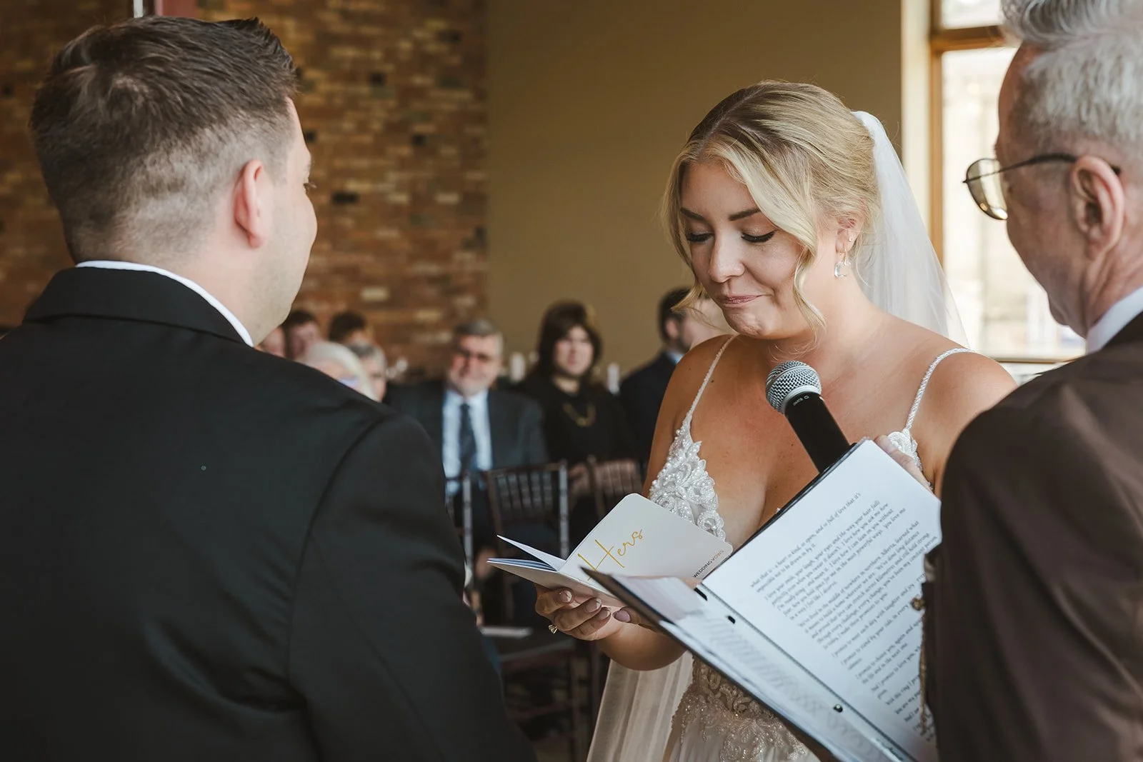 Emotional bride reading wedding vows  Arlington Hotel  River's Edge  Paris, ON  Fedora media.jpg
