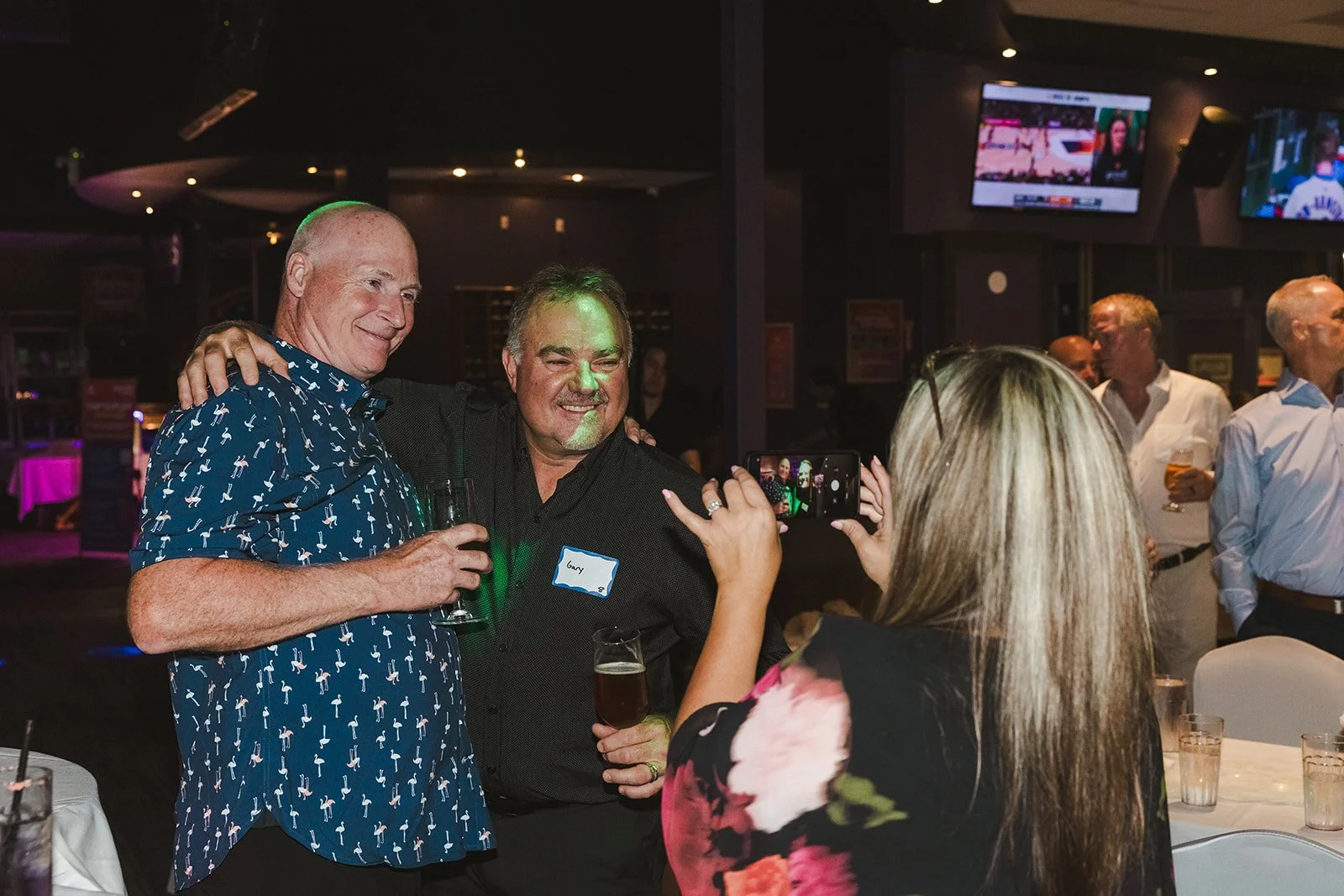 Wedding guests taking selfie at wedding  bowling alley wedding Fedora Media..jpg