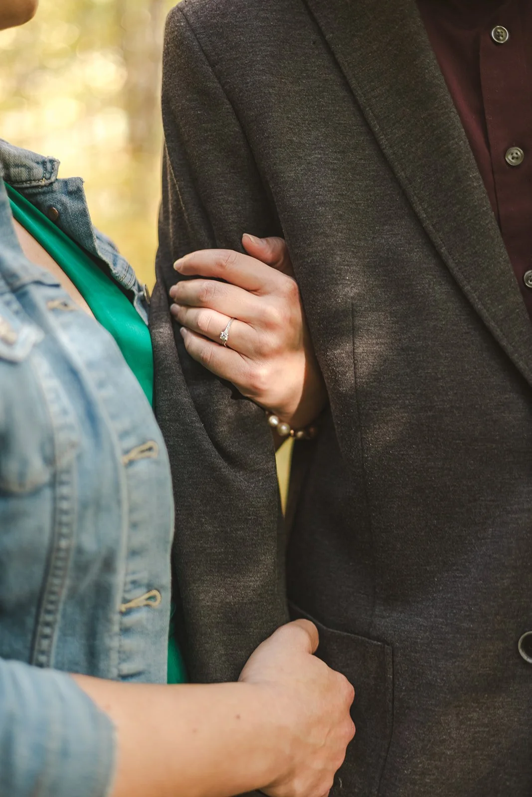 Hands holding arm with engagement ring  Ontario Engagement  Fedora Media.jpg