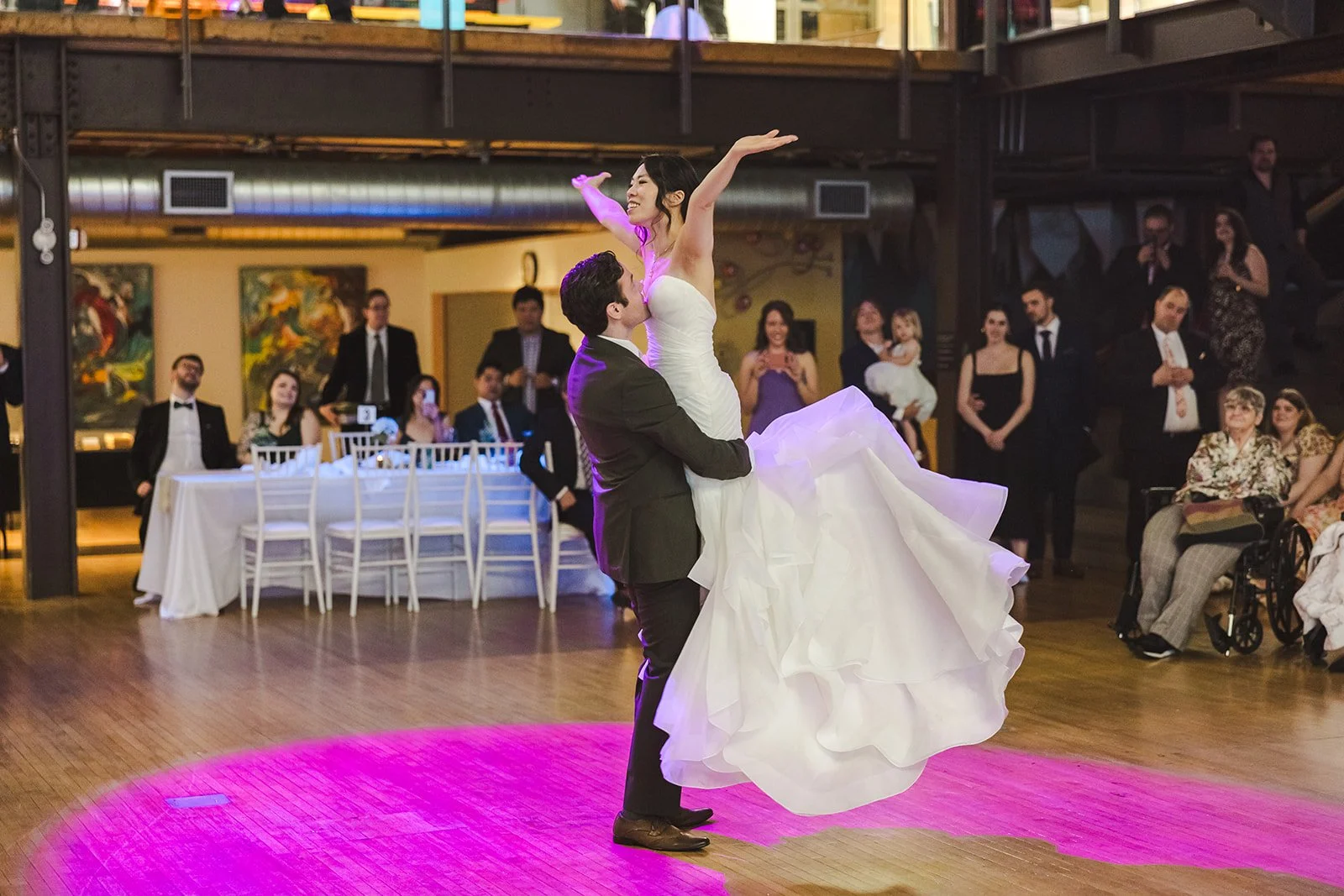 Groom lifts Bride during first dance on wedding day  Kitchener, ON  THE museum  Fedora Media.jpg
