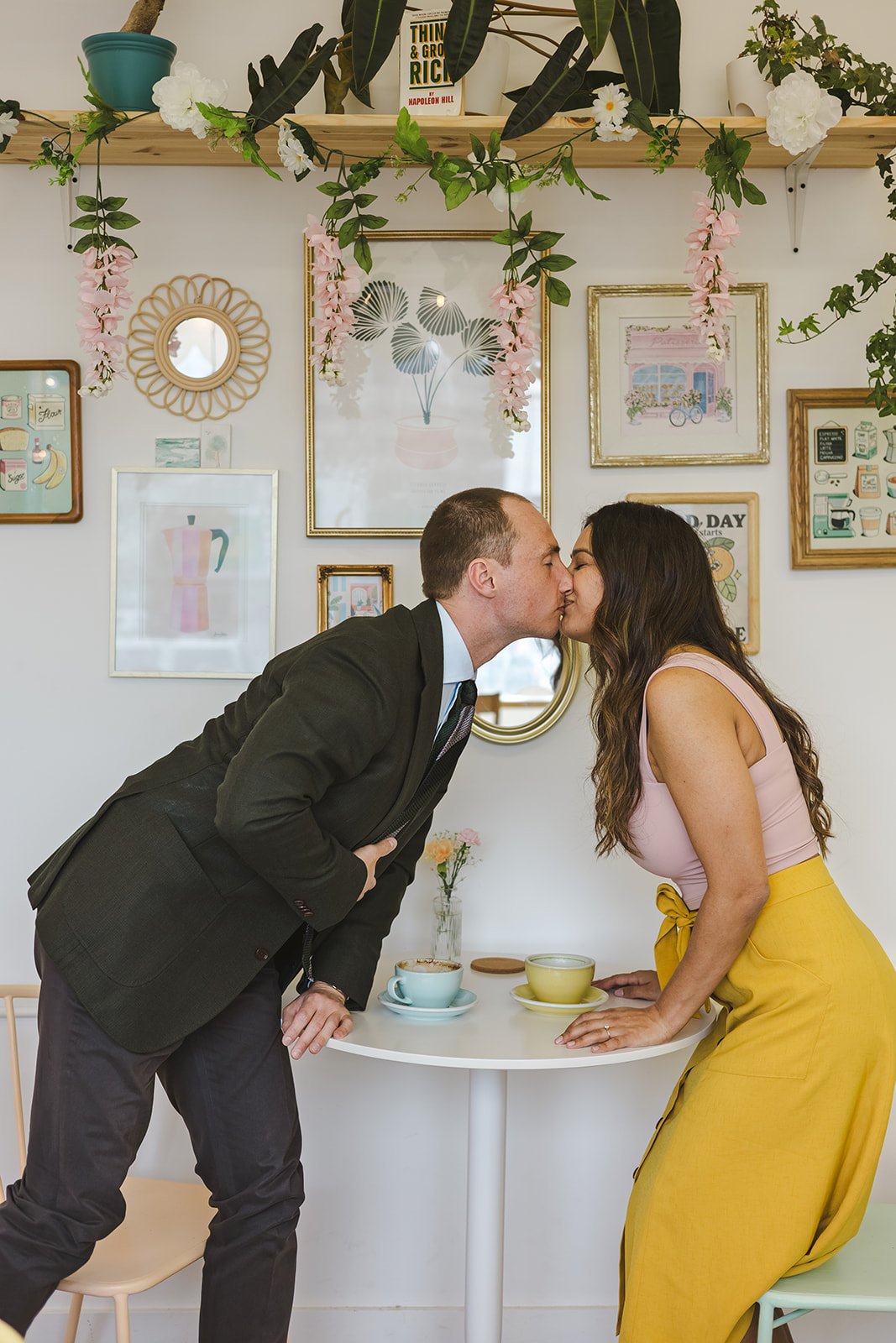 Couple kissing over cafe table  Ontario Engagement  Fedora Media.jpg