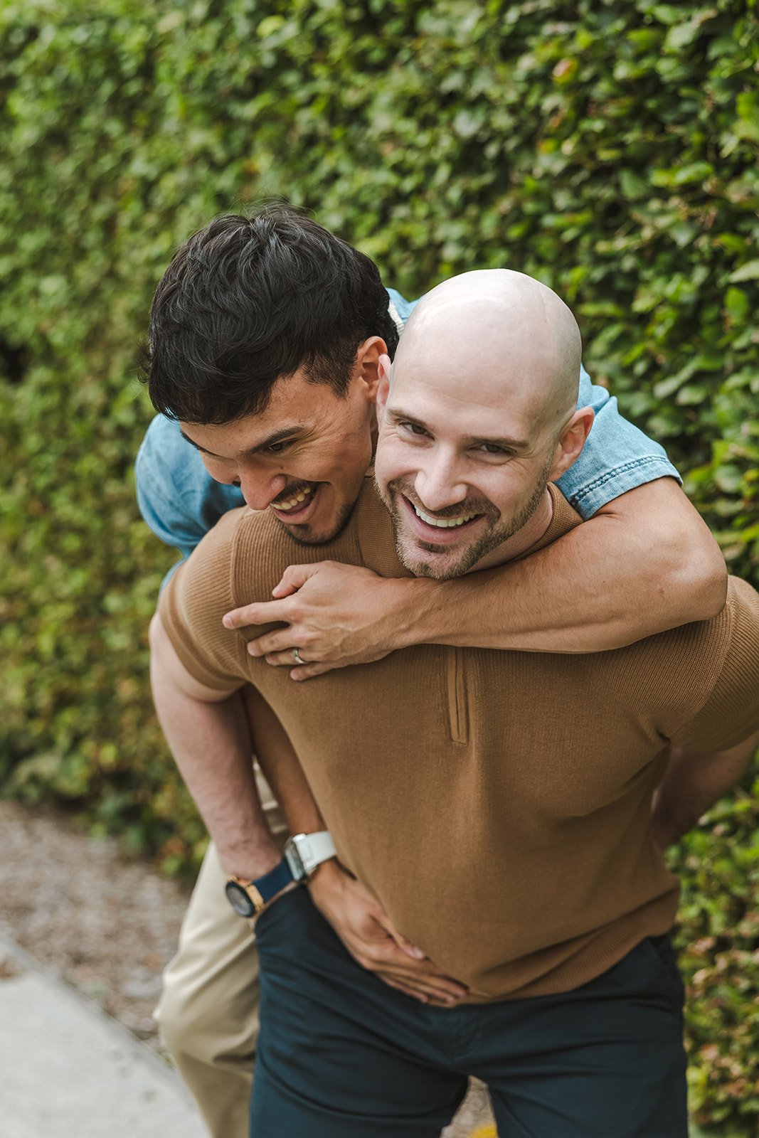 Couple candid piggyback ride moment  Ontario Engagement  Fedora Media.jpg
