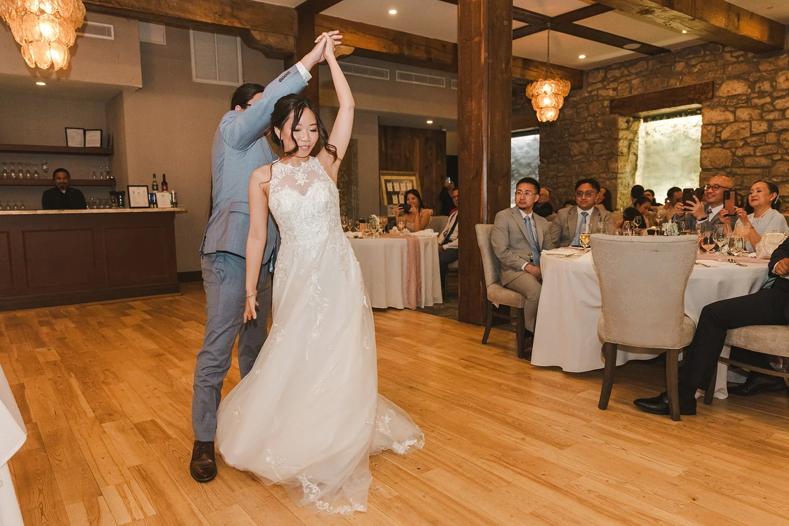 Groom twirls bride during first dance  Cambridge,  ON  Cambridge Mill  Fedora Media.jpg