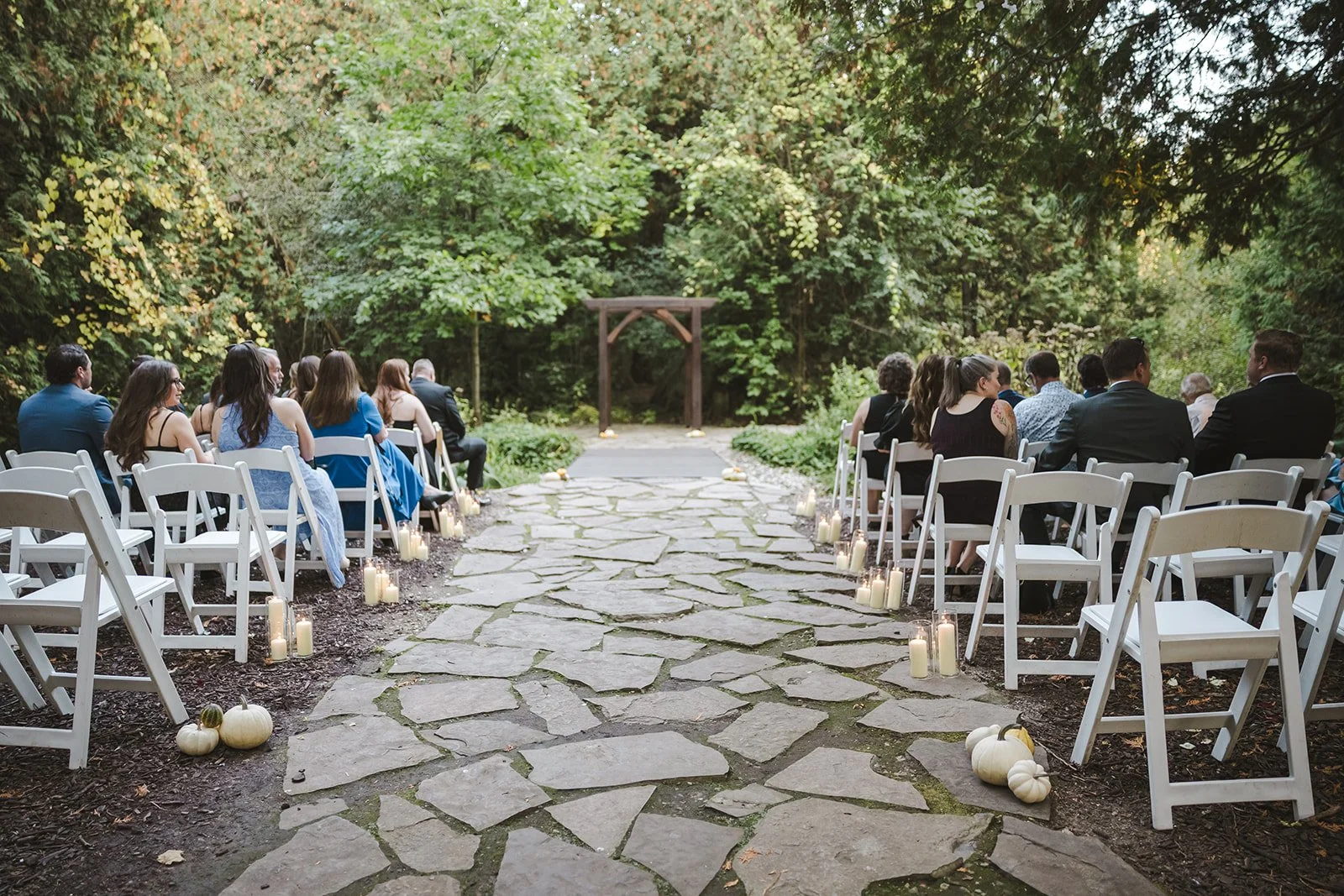 Aisle shot of altar and guests from behind  Erin Estates  Fedora Media.jpg