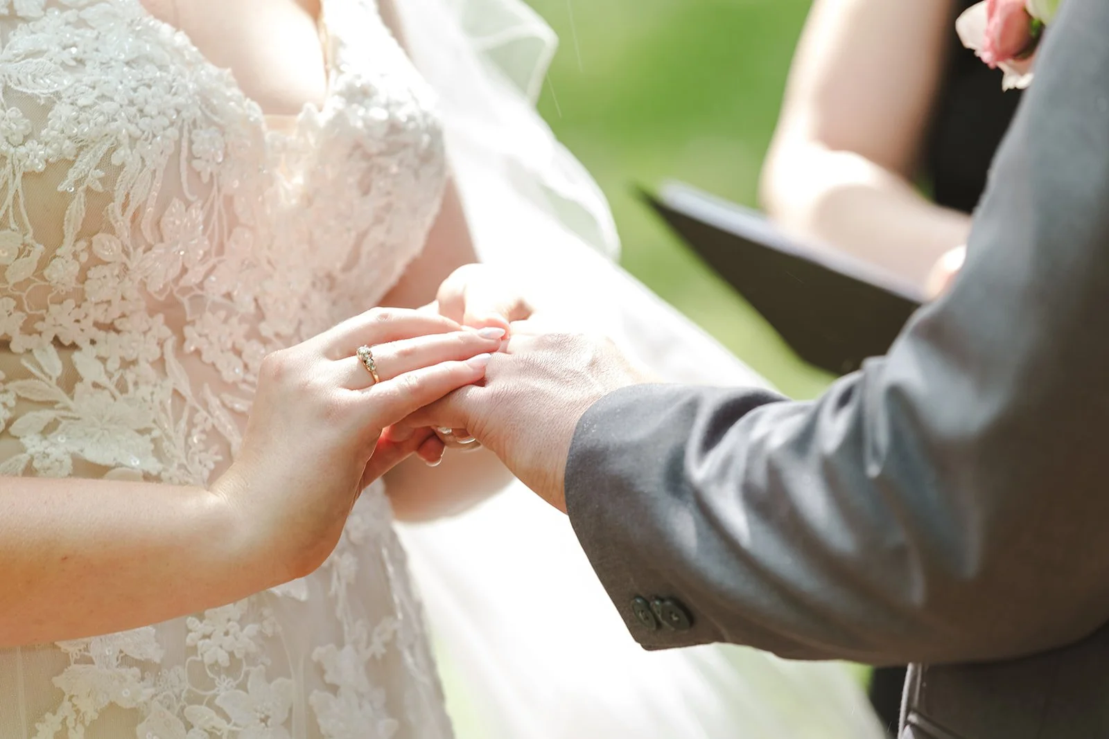 Bride puts ring on grooms finger  Boho Wedding  Fedora Media.jpg