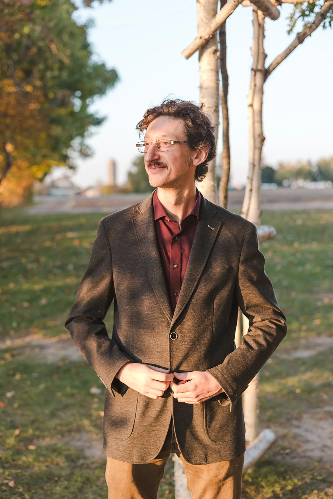 Man buttoning jacket  Ontario Engagement  Fedora Media.jpg