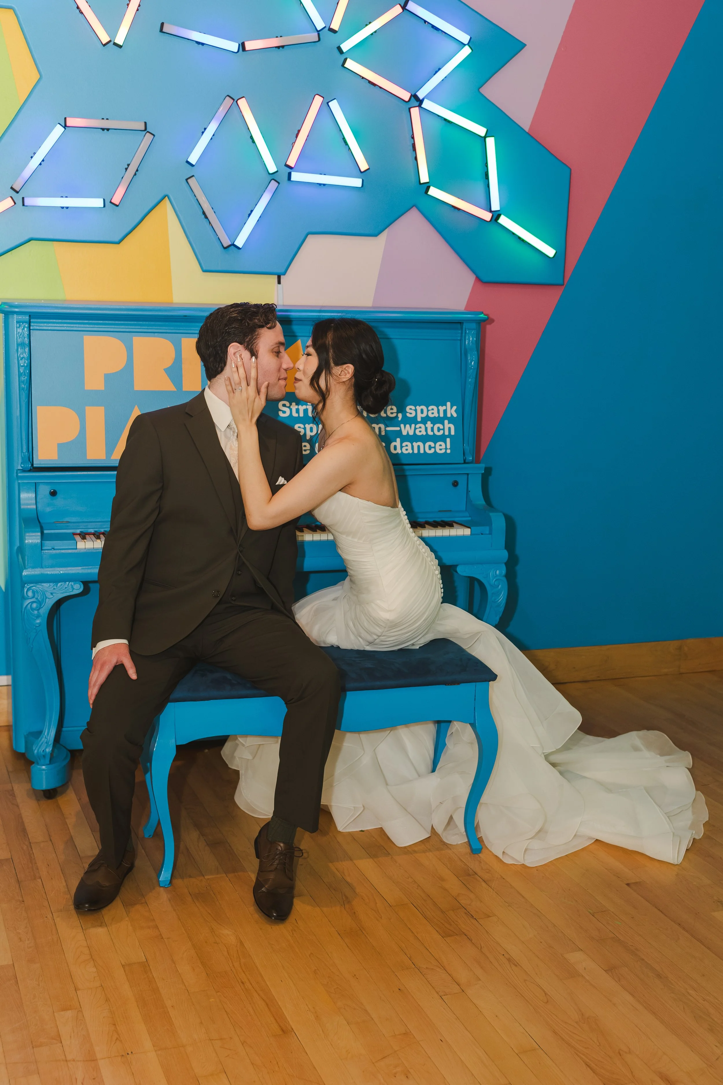 couple-sitting-on-blue-piano-Fedora-Media.jpg