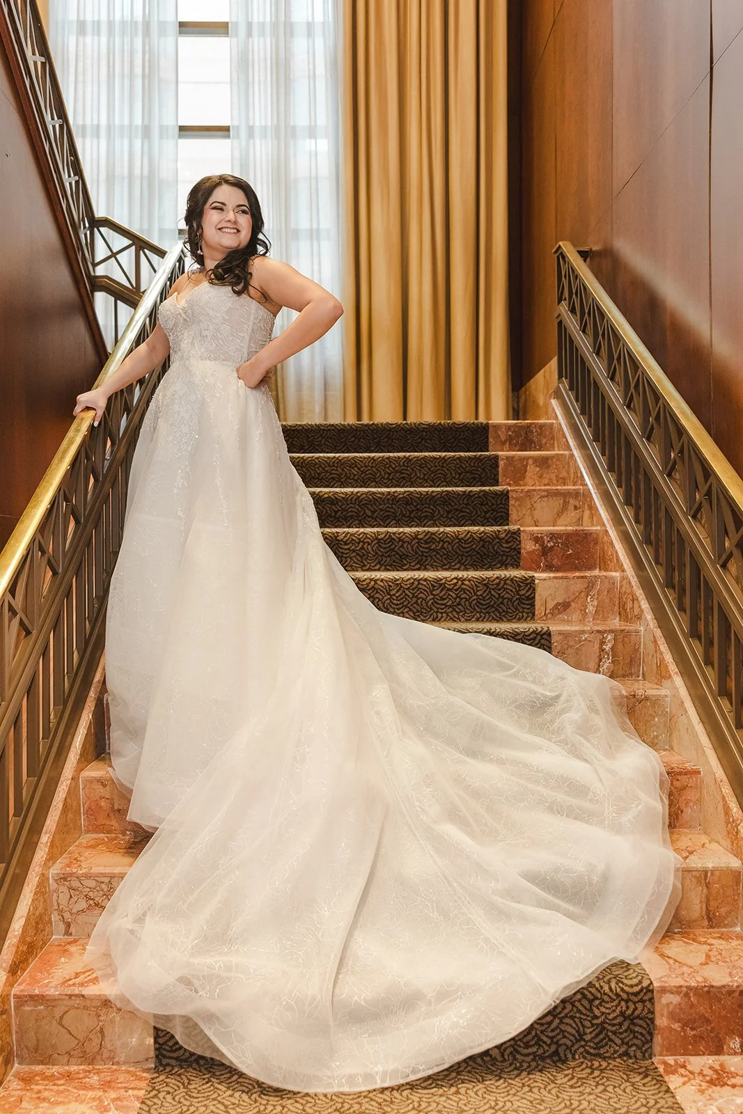 bride-on-stairs-in-weddding-gown-fedora-media.jpg