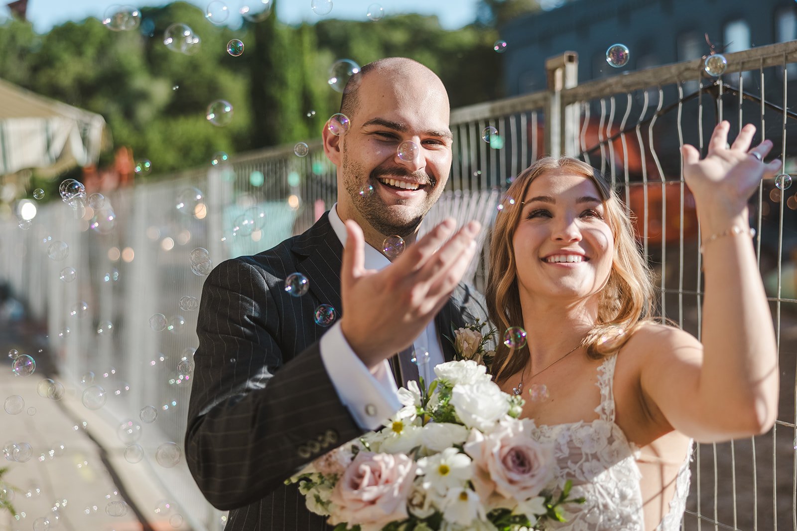 Bride and Groom laughing in bubbles  Paris, ON  Arlington Hotel  River's Edge  Fedora Media.jpg
