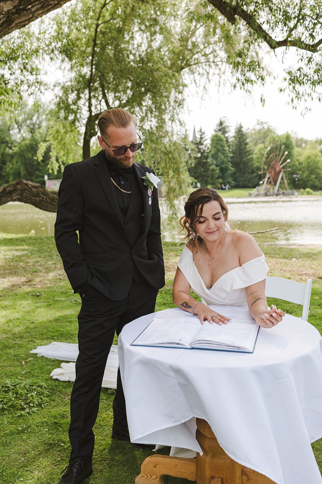 Bride and groom sign wedding certificate  Puddicombe House  New Hamberg, ON  Fedora Media.jpg