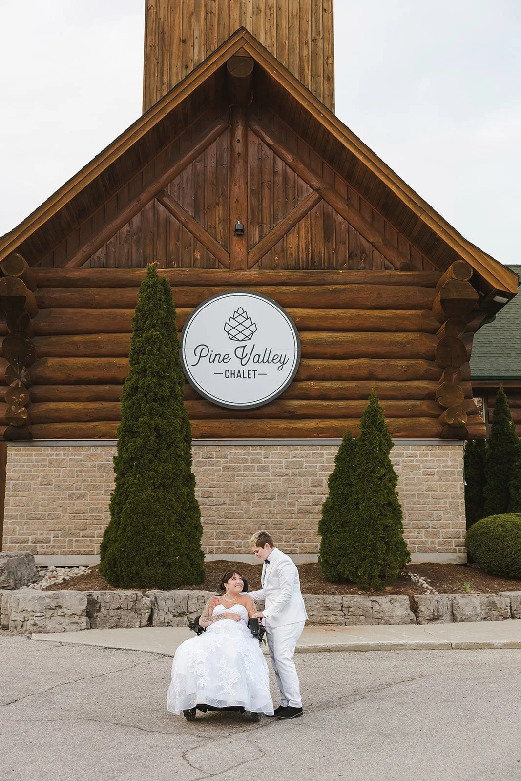 Brides in front of venue  Pine Valley Chalet  Kitchener, ON  Fedora Media.jpg