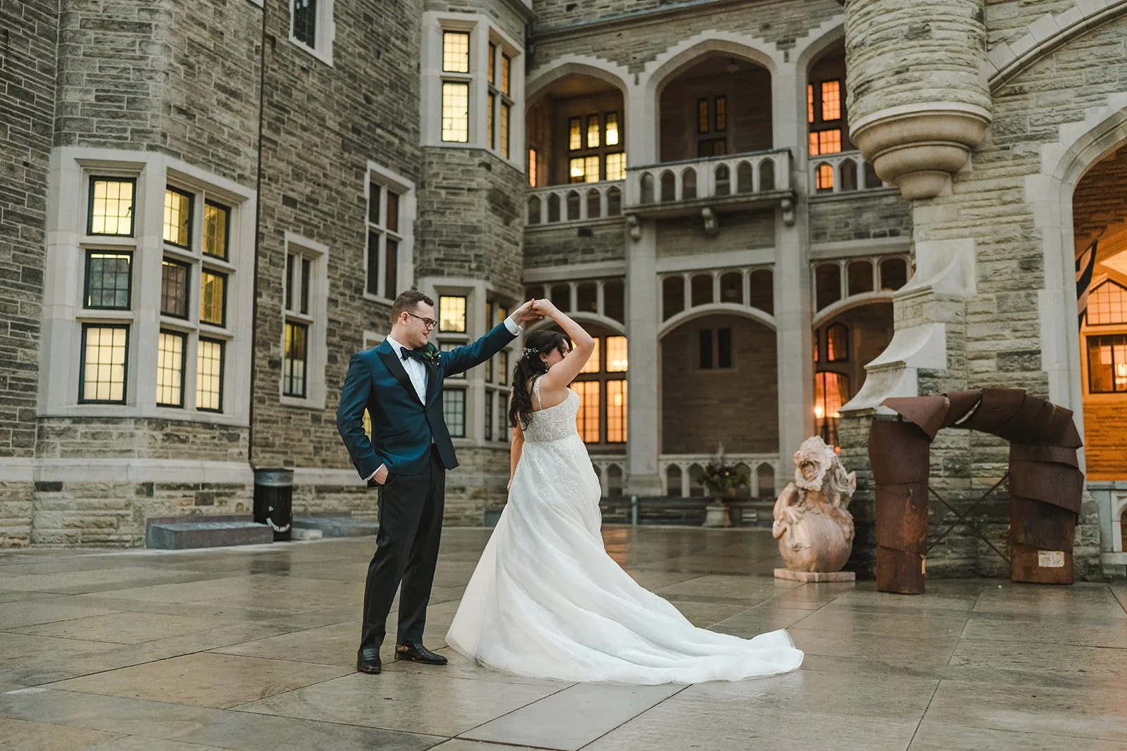 bride-and-groom-dance-in-courtyard-fedora-media.jpg