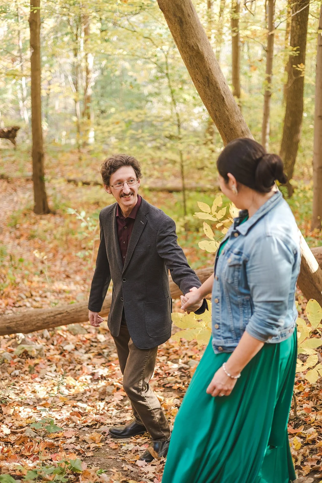 Man reaching out for woman in forest  Ontario Engagement  Fedora Media.jpg