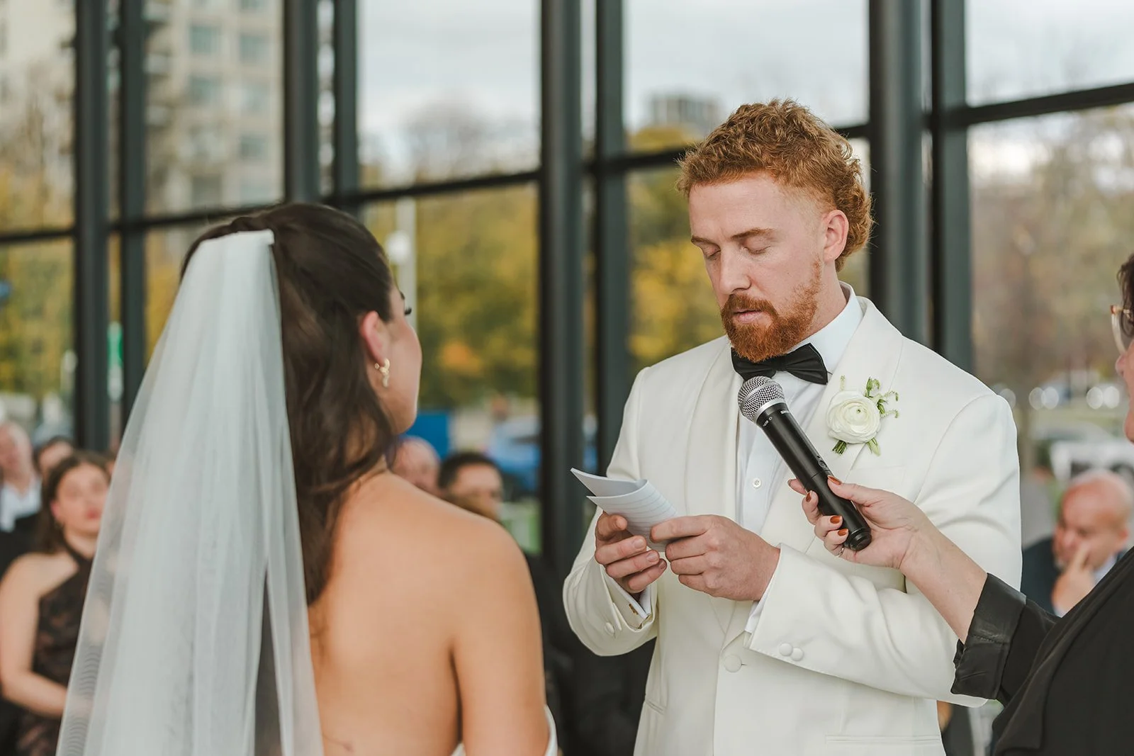 Groom reading vows during wedding ceremony  Spencers at the waterfront  Pearle weddings  Burlington, ON  Fedora Media.jpg