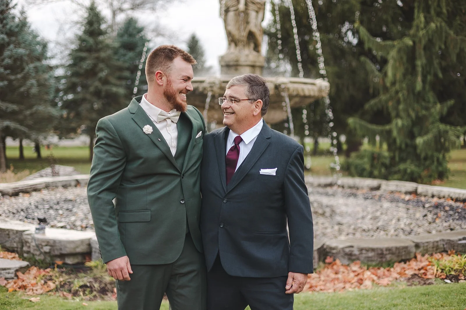 Groom smiling at dad  fall wedding  Fedora Media.jpg