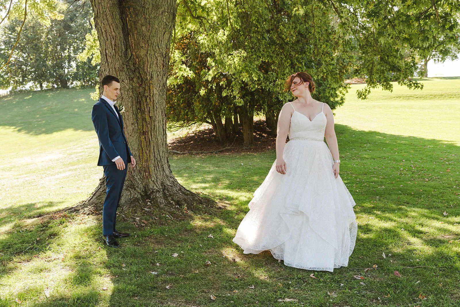Groom admiring bride during first look  Golf Course Wedding  Fedora Media.jpg