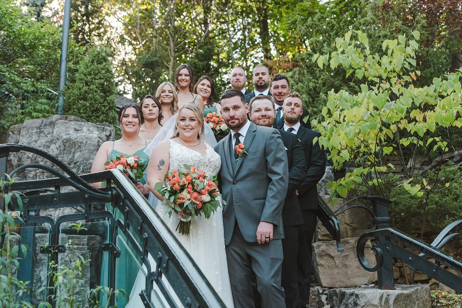 Bride and groom with wedding party on stairs  Ancaster,  ON  Ancaster Mill  Fedora Media.jpg