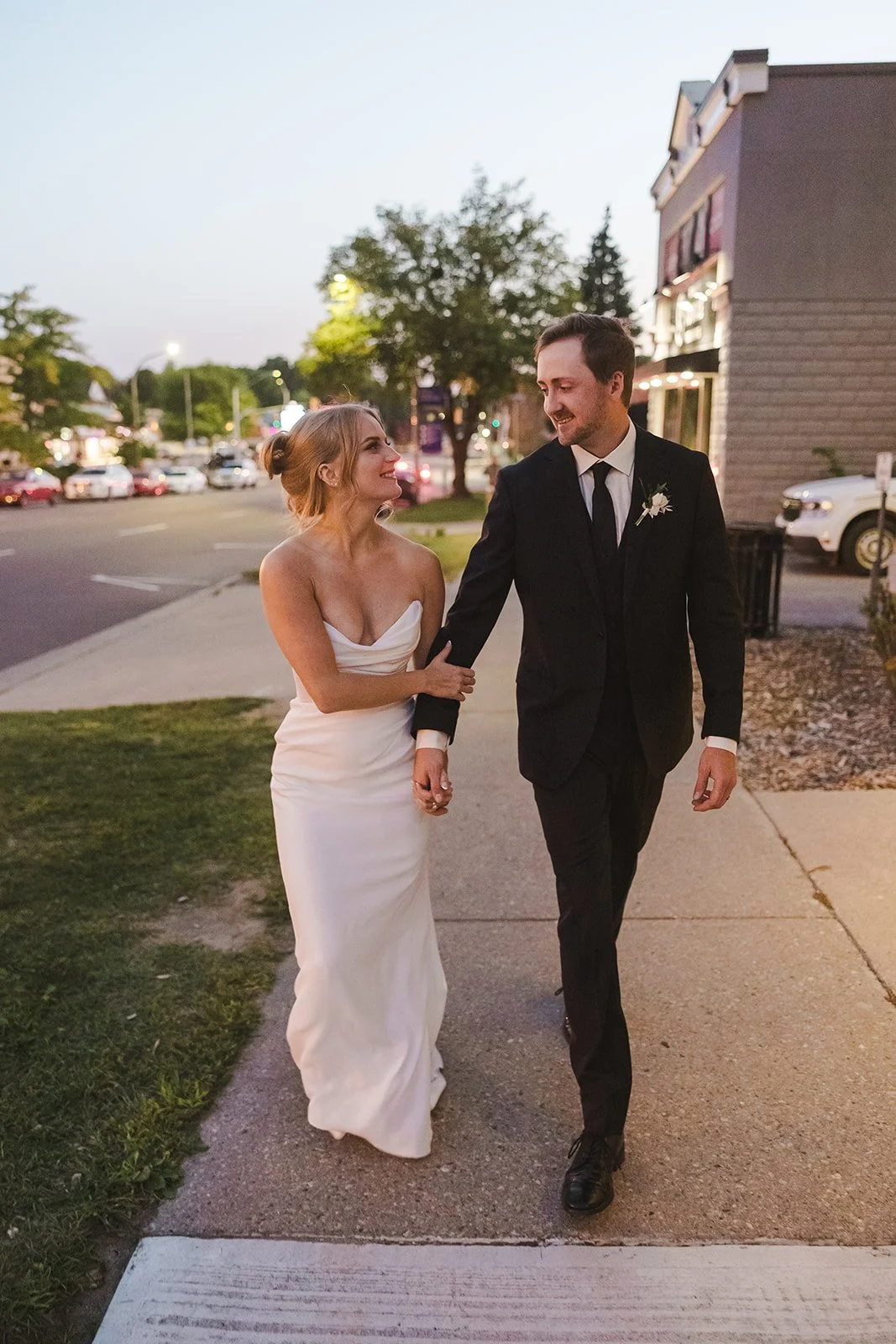 Bride and groom walking at dusk  Straford, ON  Fedora Media.jpg