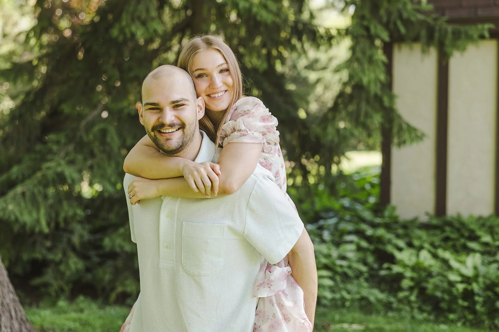 Couple piggyback moment  Ontario Engagement  Fedora Media.jpg