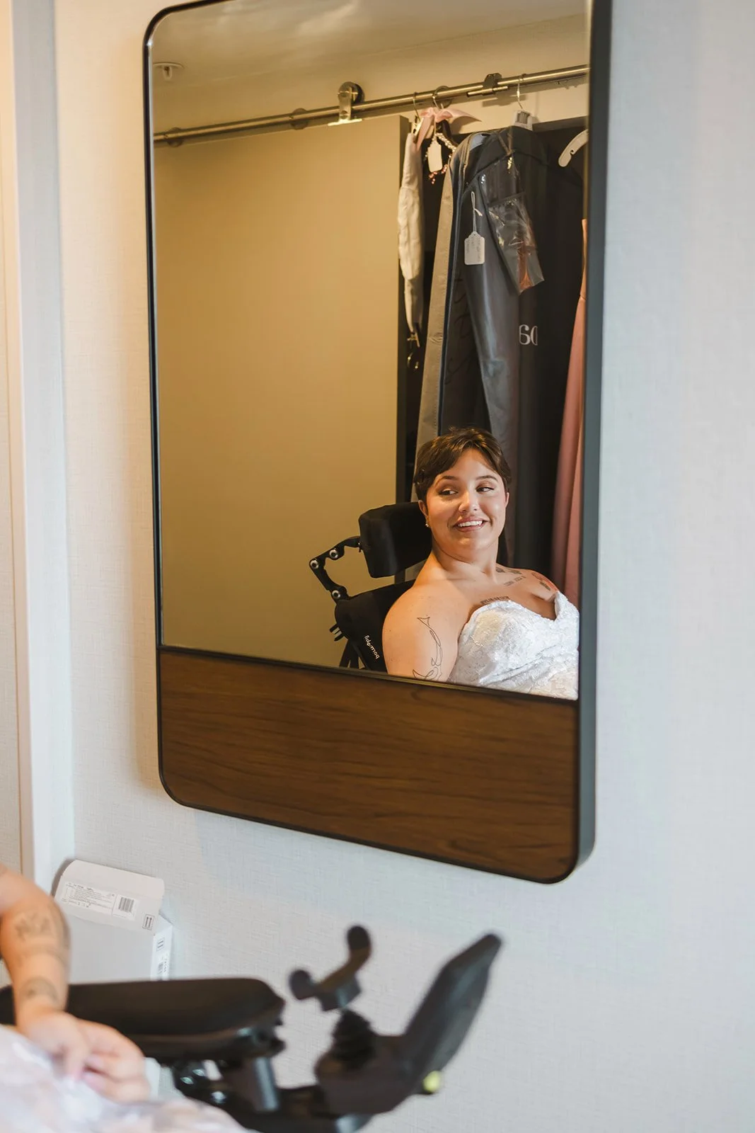 Bride smiling in mirror  Pine Valley Chalet  Kitchener, ON  Fedora Media.jpg
