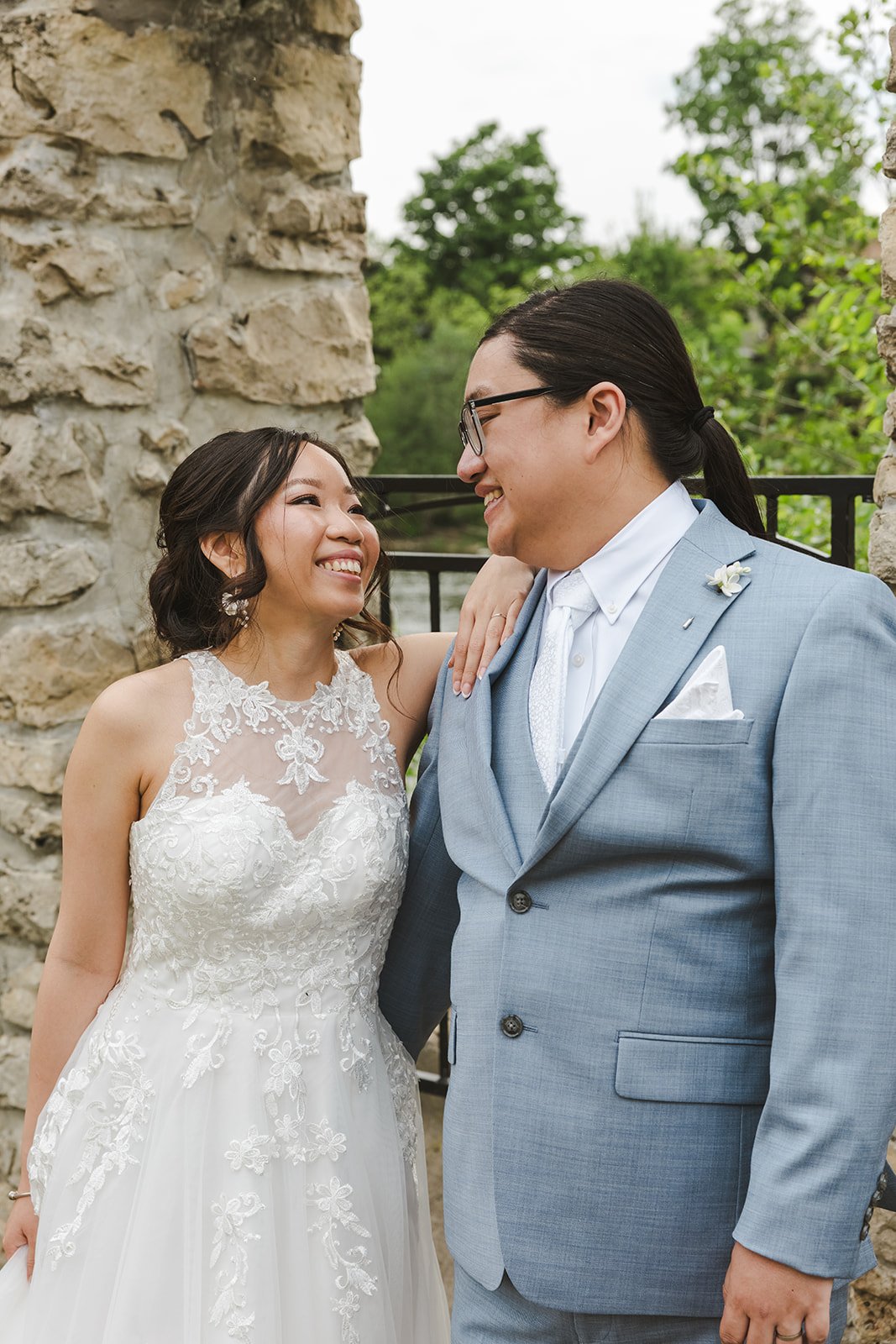 Bride leaning on Groom's shoulder and smiling  Cambridge,  ON  Cambridge Mill  Fedora Media.jpg