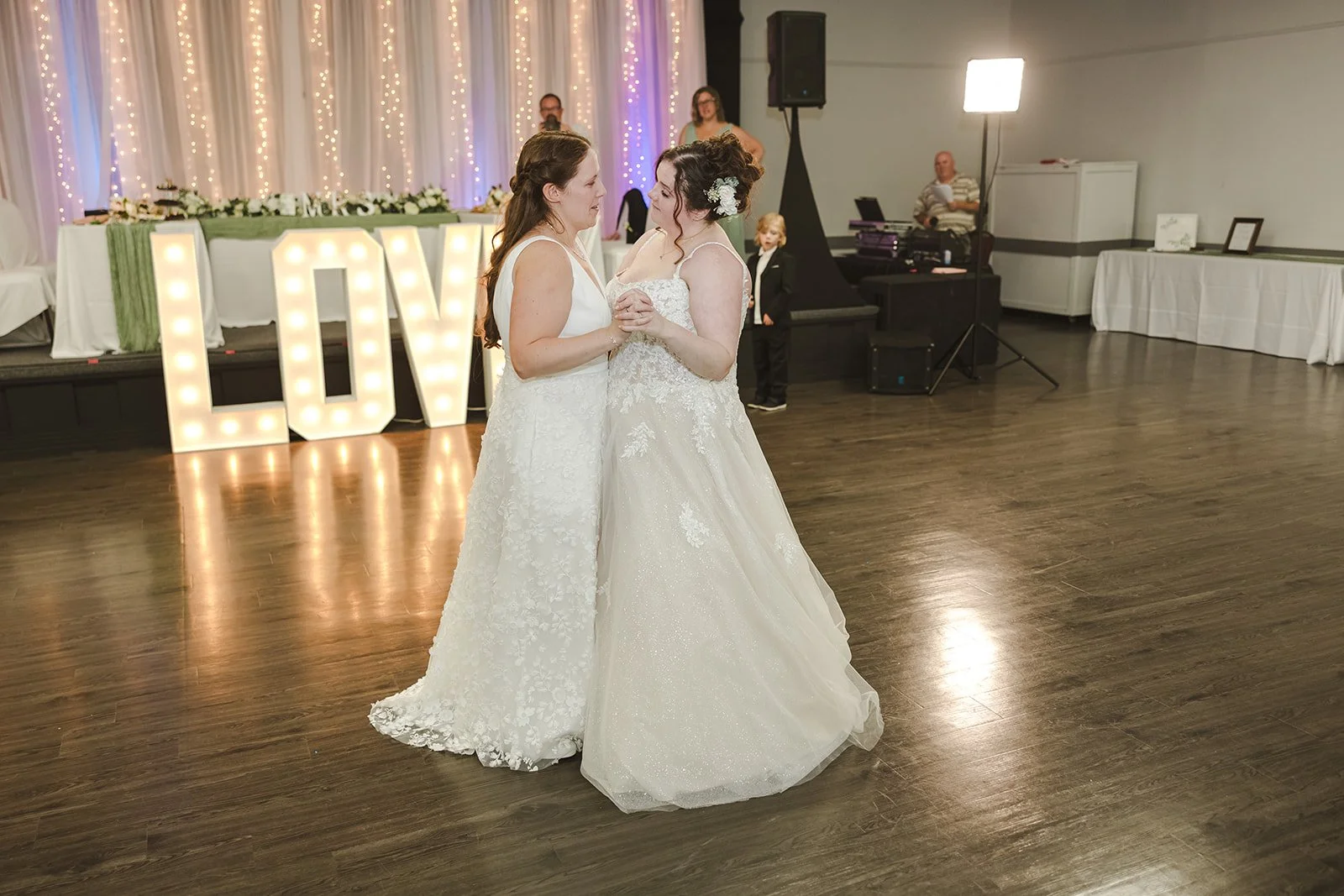 Two brides share first dance during wedding reception  Newfoundland Club  Cambridge, ON  Fedora Media.jpg