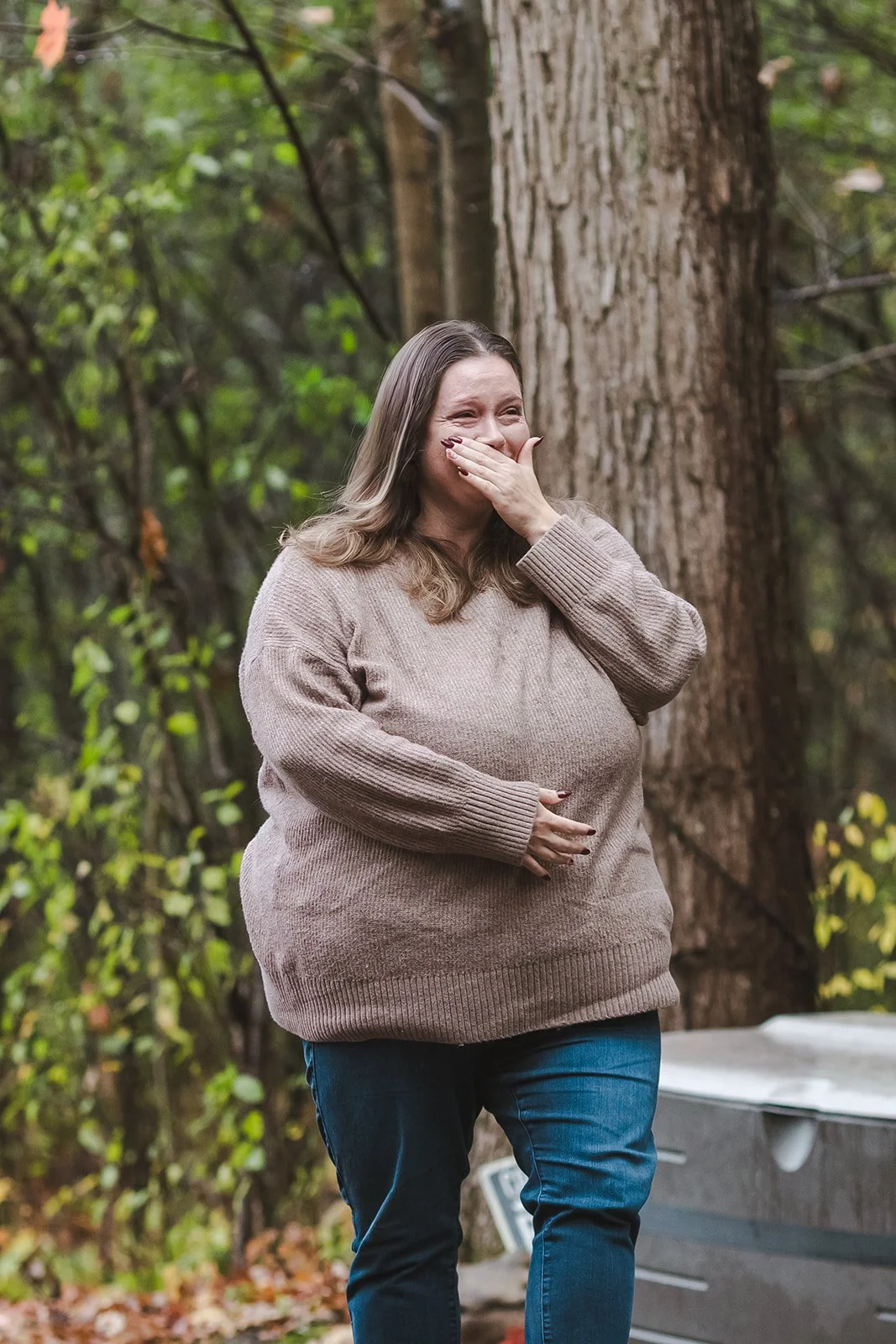 Woman in brown sweater crying  Cabin Propsal  Fedora Media.jpg