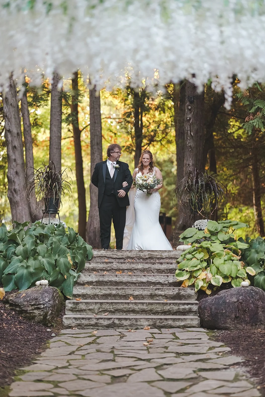 Bride and father walking down aisle toward altar  Erin Estates  Fedora Media.jpg