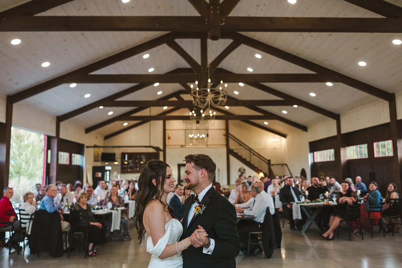 Intimate first dance moment with wedding guests  Barn Swallows at Thatcher Farm  Fedora Media.jpg