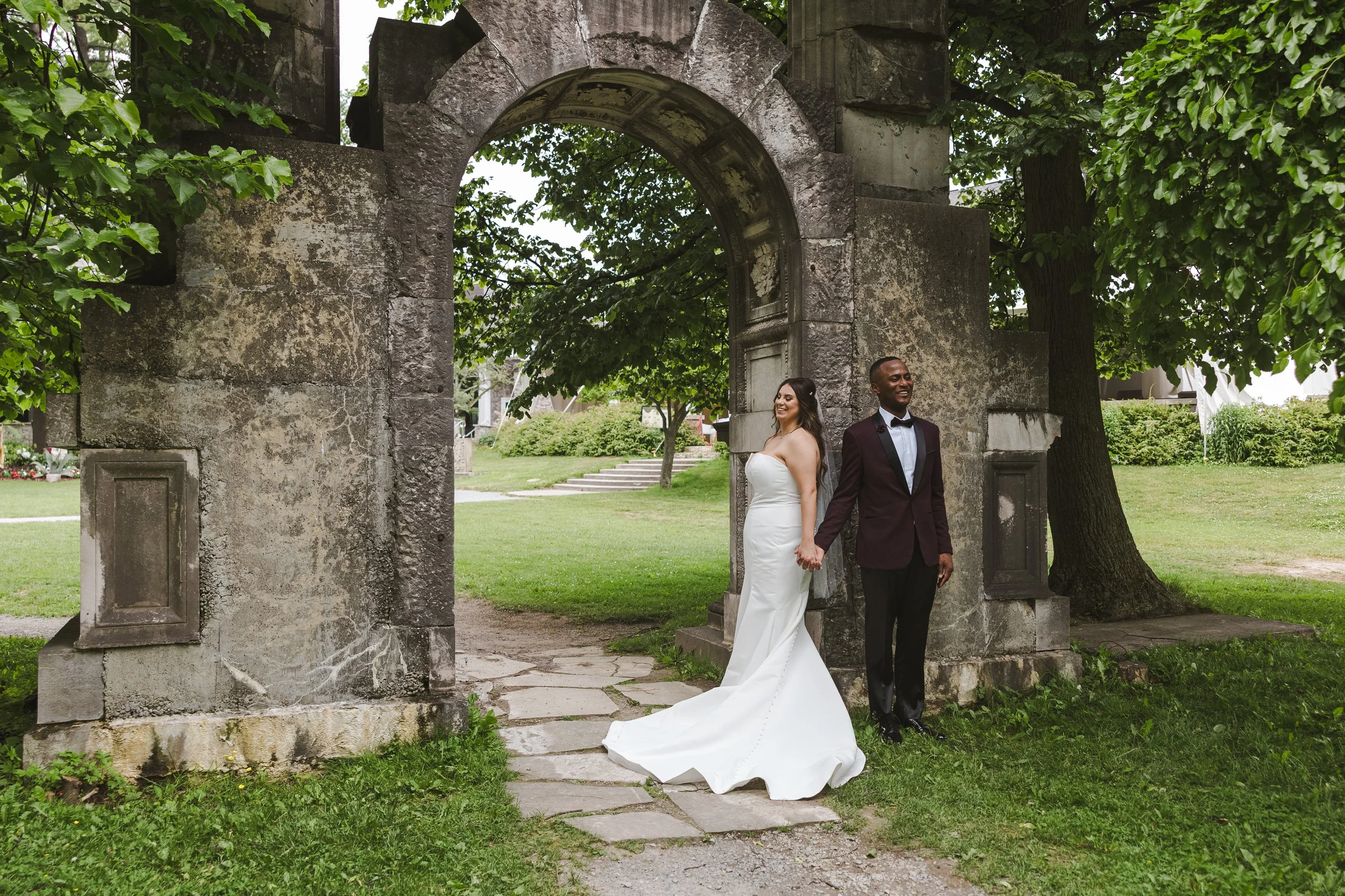 couple-under-old-arch-walkway-fedora-media.jpg