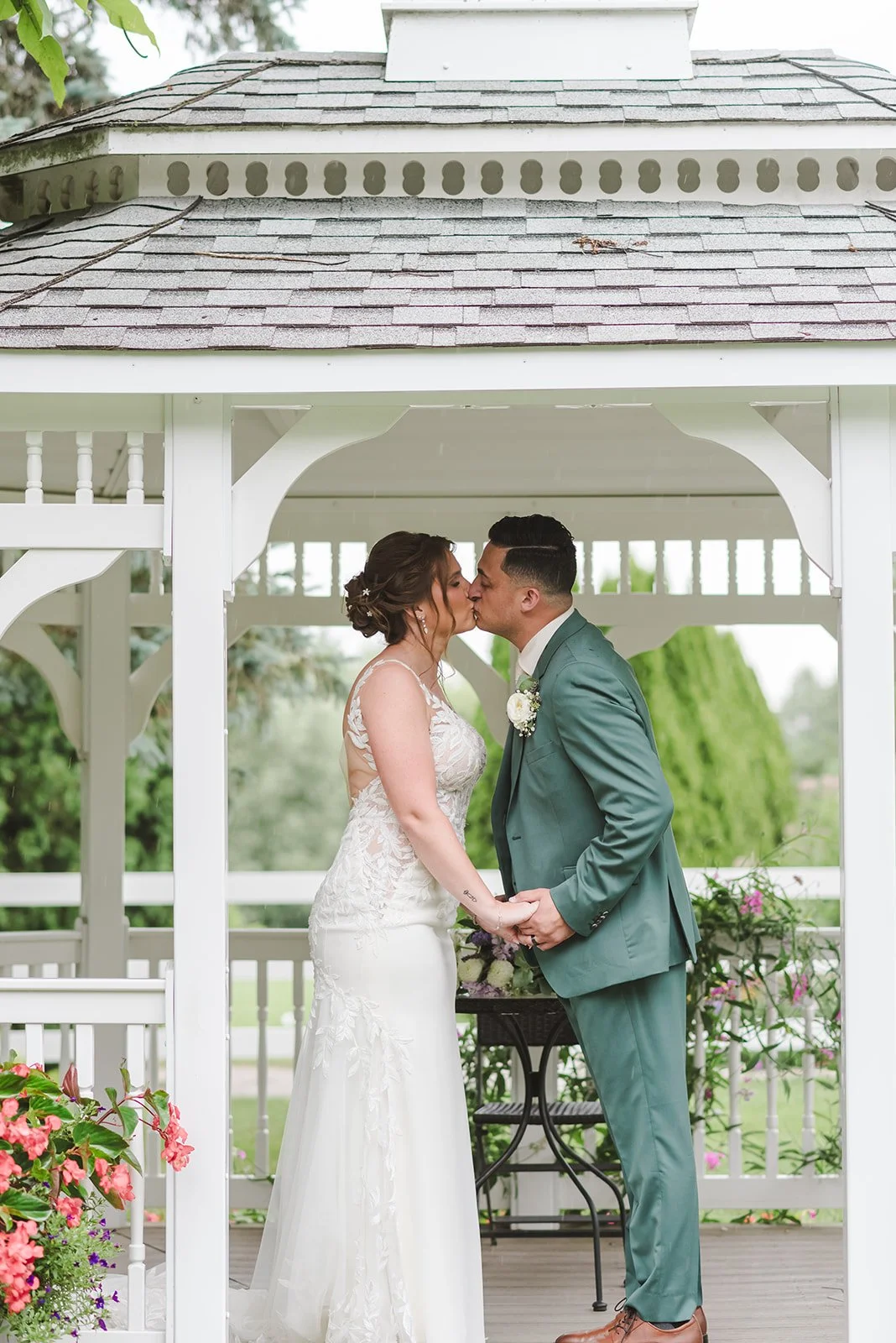 Bride and groom kiss in gazebo  Springfield Golf & Country Club  Fedora Media.jpg