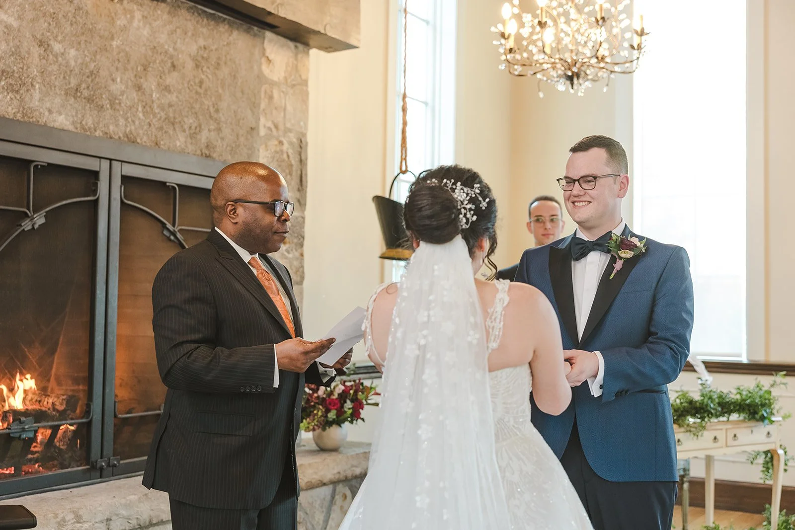 Groom smiling during wedding ceremony  Ancaster,  ON  Ancaster Mill  Fedora Media.jpg