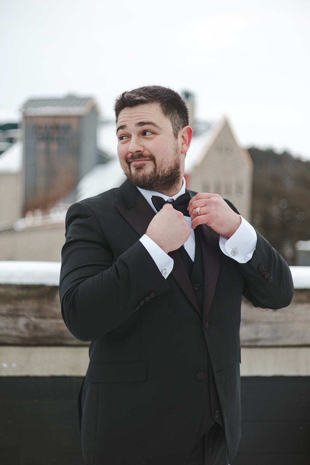 Groom adjusting bow tie  Elora Mill  Elora, ON  Fedora Media.jpg
