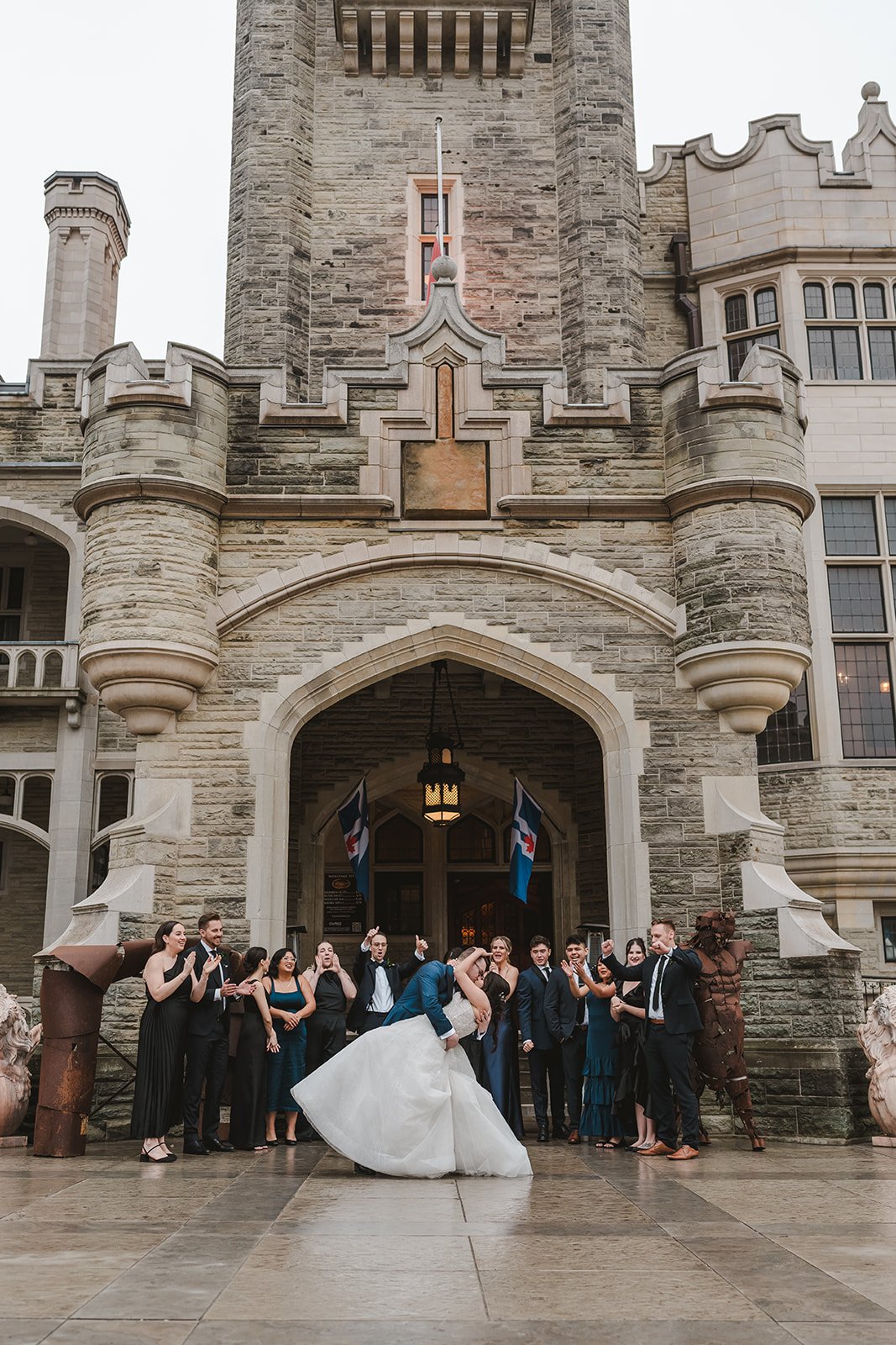 wedding-party-outside-castle-entryway-fedora-media.jpg